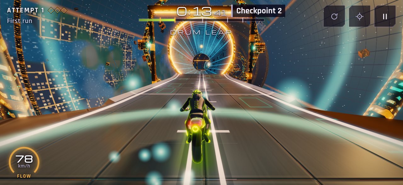 Level 12, Orbital Foundry: the bike heads for a glowing ring at the mouth of a rotating drum.
